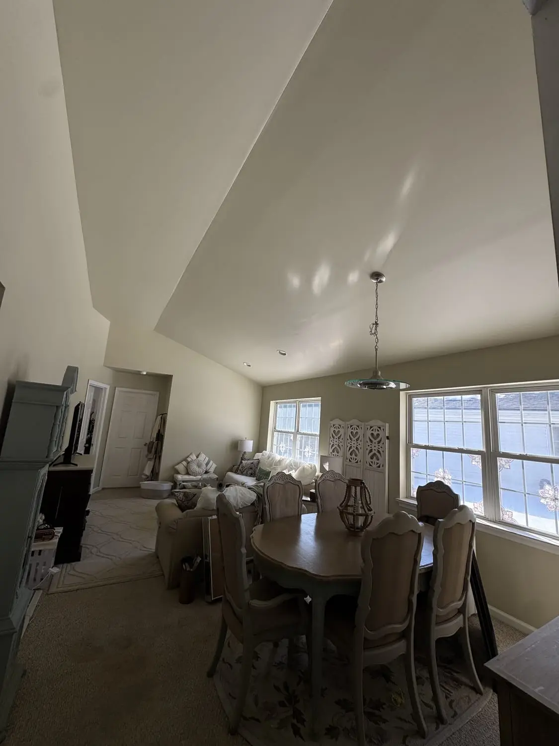 Bright vaulted dining room with a clean, even repaint and white trim