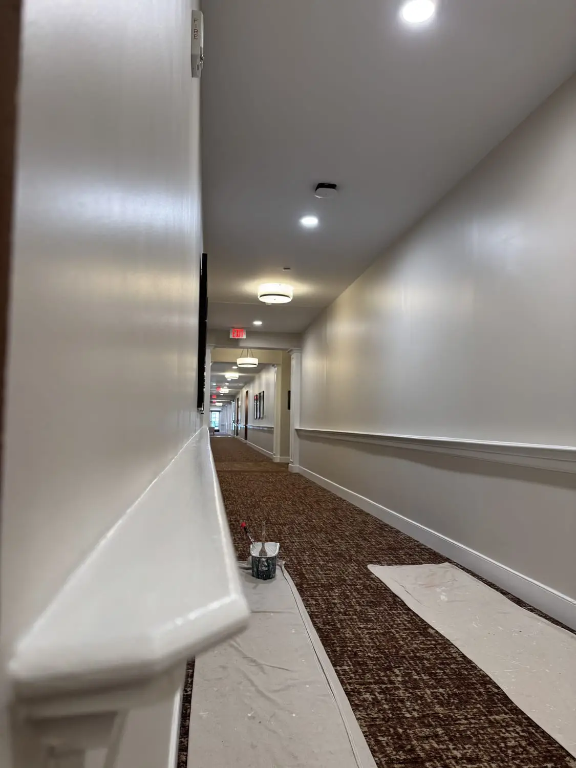 Long interior hallway with a fresh, even repaint and clean trim lines
