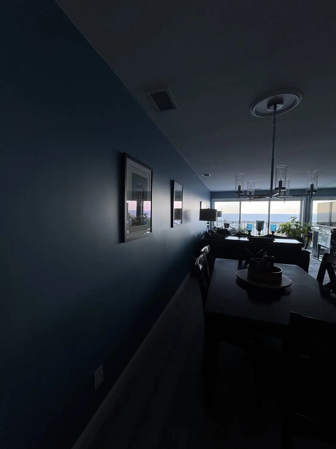 Dramatic deep-navy hallway with a flawless finish